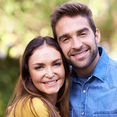 Image showing Face, couple and outdoor with smile in hug for bonding, love and support to relax together. Portrait, relationship and happy with fun at park as family, soulmate and commitment on break or holiday