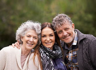 Image showing Portrait, outdoor and old parents with daughter, embrace and happiness with nature and bonding together. Face, family or adult with fresh air and hug with smile and senior mother with mature father