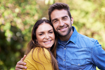 Image showing Portrait, couple and outdoor with smile on hug for bonding, love and support to relax together. Relationship, romance and happy or fun at park as family, soulmate and commitment with break