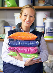 Image showing Woman, polymer and plastic in factory, pellets and dye manufacturing and ecology in portrait at store. Person, color and employee for recycling at plant with storage, particles and bags in warehouse