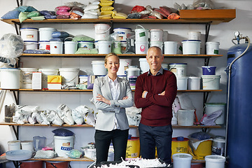 Image showing Businessman, woman and equipment in workshop for maintenance, manufacturing and job confidence. Senior person, arms crossed and mature contractor with paint for repairs, renovation or remodeling