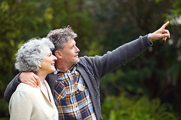 Image showing Older couple, pointing or love to relax in park by thinking, bonding or together in happy retirement. Senior people, smile or vision of rest in nature as conversation, memory or idea of dream holiday