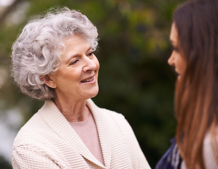 Image showing Senior woman, mother and daughter with smile for love, bonding and visit from relatives outdoor in backyard, garden and patio. Elderly female person, young lady and family bonding together in Italy