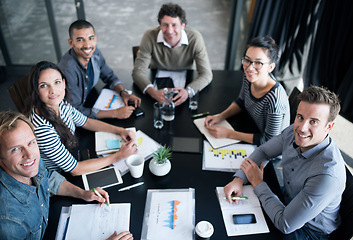 Image showing Employees, smile and office for meeting or planning for teamwork with graphs, charts and finance reports. Diverse people or colleagues with statistics for discussion and career for employment