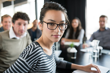 Image showing Creative, woman and portrait in serious meeting at office with teamwork, collaboration and cooperation on project. Professional, conference and planning a development for London company with group