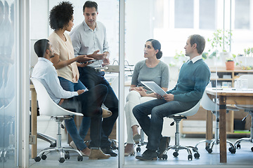 Image showing Employees, talking and office for meeting or planning for teamwork and profession in organisation. Diverse people or colleagues for discussion and career for employment and ideas for company indoor