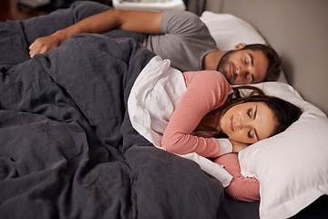 Image showing Couple, sleeping and tired in bed, home and rest with dream, peace and quiet on holiday together. Man, woman and lying with blanket in bedroom for vacation with pajamas at apartment in Argentina