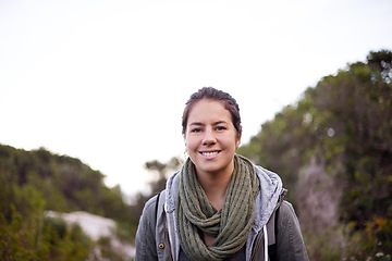 Image showing Outdoor, hiking and portrait of girl with smile for nature, hill and joy for journey in foliage or bush. Adult, female person and woman with happiness for travel for winter holiday in Cape Town