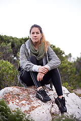 Image showing Woman, mountain and relax on hiking break in forest for leisure or fitness routine to exercise and workout. Portrait, female person and outdoor on hill with nature, peace and adventure on holiday