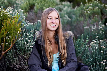 Image showing Woman, hiking and flower environment for mountain exploring or adventure, trekking or view. Female person, plants and outdoor journey for holiday wellness or backpacking vacation, exercise or travel