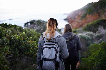 Image showing Women, friends and hiking mountain or trekking environment for holiday vacation, adventure or backpacking. Female people, back and explore walking for healthy training or outdoor, exercise or bush