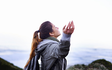 Image showing Hiking, woman and winning with celebration, seaside and fresh air with fitness and breathing. Person, outdoor or hiker with freedom or carefree with girl or healthy with wellness or ocean with joy