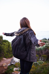 Image showing Woman, hiking and celebration of mountain view for nature adventure for backpacking journey, travel or vacation. Female person, back and foliage for training trekking or exercise, freedom or fitness