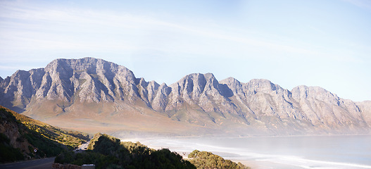 Image showing Mountain, ocean and environment landscape for holiday exploring or trekking hiking, vacation or journey. Hill, seaside and summer morning in Australia wilderness as adventure travel, scenic or nature