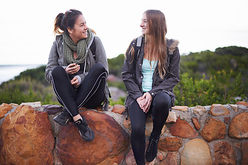 Image showing Women, friends and relax on hike in forest for walking, workout or exercise as fitness routine in nature. People, adventure and landscape in countryside with trees, plants and journey for leisure