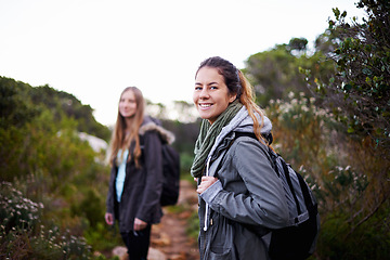 Image showing Friends, women and smile in forest with hiking for adventure or leisure as fitness routine, exercise and workout in Australia. Portrait, outdoor and woods or hill with nature, peace and bonding