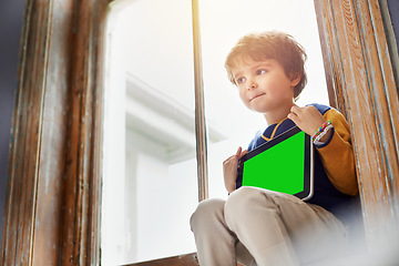 Image showing Home, tablet and kid with green screen on internet, app or mockup space for learning by windowsill. Technology, chroma key and child with display for advertising, marketing or thinking of idea