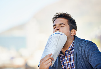 Image showing Unemployment, newspaper and man tired in outdoor for search, job hunting and stress. Article, thinking and male person for frustrated, exhausted and disappointed with lack of employment opportunity