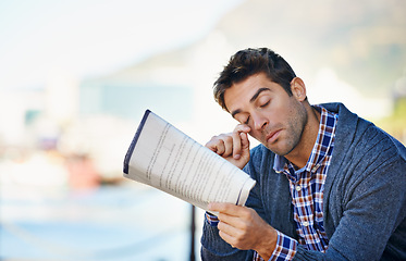 Image showing Tired, newspaper and unemployed man in outdoor for search, job hunting and stress. Article, thinking and male person for frustrated, exhausted and disappointed with lack of employment opportunity