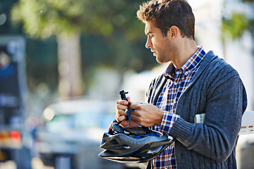 Image showing City, man and cyclist outdoors with helmet for eco friendly transportation, adventure and journey on vacation. Male person, mockup and thinking for weekend travel, cycling and tourism in Amsterdam