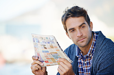 Image showing Thinking, newspaper and man in outdoor for search, job hunting and serious. Newsletter, thought and male person with ideas, decision and consideration in planning for employment opportunities