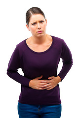 Image showing Woman, stomach pain and portrait in studio with hands, period and digestion by white background. Girl, person and model with constipation, gas or abdomen with diarrhea, burnout or worry with disease