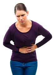 Image showing Stress, anxiety and woman with stomach pain in studio for gas, constipation or pms crisis on white background. Menstruation, cramps or female model with gut health problem, virus or endometriosis