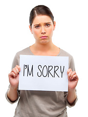 Image showing Sad, portrait and woman with Im sorry poster in studio with mistake, fail or regret on white background. Apology, face and female model frown with banner, announcement or broken heart presentation