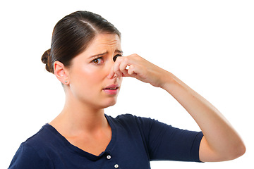 Image showing Gross. Smell, yuck and portrait for woman with disgust facial expression for gross, fart and odor on white background. Young person and isolated with finger on nose for stink, wtf or scent on mockup.