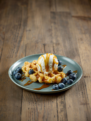 Image showing plate of belgian waffle with vanilla ice cream