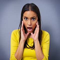 Image showing Woman, shock and mouth open in studio portrait for news, gossip or announcement by blue background. Girl, person and model with surprise, wow or expression for drama with story, information or secret