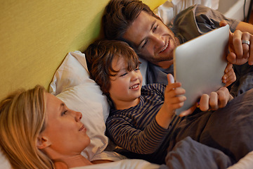 Image showing Bed, parents or child with tablet for streaming, playing games or watching videos on movie website in home. Social media, happy kid or mom with dad or technology to download on ebook online at night