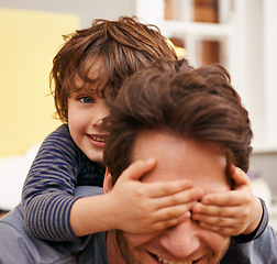 Image showing Boy, father and play for covering, eyes with hands and fun or joy at family home together. Child, dad and smile with love, care and house for bonding and parenting with responsibility in bedroom