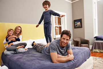 Image showing Home, parents and kids fun on bed with love, support and bonding together with a smile. Happy, family and children with mom in the morning in the bedroom play with sibling in a house with parenting