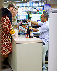 Image showing Payment, cashier and king with queen, shopping and increase with groceries and inflation sales. Finance, royal couple and man with woman and service with economy and buying with store and retail