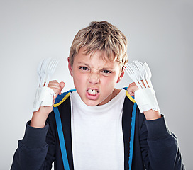 Image showing Portrait, angry and boy with fist, child and expression with frustrated on grey studio background. Face, bully and kid with forks for claws and reaction with costume and aggressive with rage or fight
