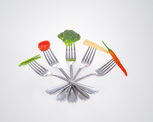 Image showing Fork, vegetables and nutrition with design, wellness and utensils on a white studio background. Food, diet plan and mockup space with kitchen tools and promotion with steel and metal with cutlery