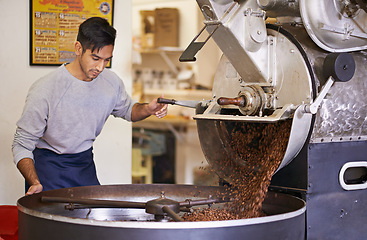 Image showing Coffee, beans and man with machine for roasting with blending, production and quality control. Entrepreneur, barista or roaster with small business at cafe, sustainable startup and espresso process