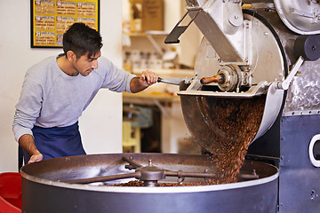 Image showing Coffee, cafe and man with machine for roasting with blending, production and quality control. Entrepreneur, barista or roaster with beans at small business, sustainable startup and espresso process