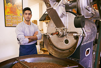 Image showing Coffee, roasting and portrait of barista with confidence in small business, process or quality control. Entrepreneur, man and machine with beans at espresso cafe, sustainable startup and arms crossed