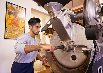 Image showing Man, machine and industry for grinding coffee with roast, process and flavor for export in factory. Person, employee and tools for caffeine, beans or press with manufacturing at warehouse in Colombia