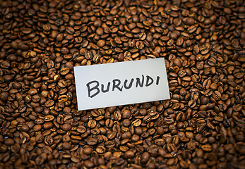 Image showing Coffee, roasted beans and closeup with product of Burundi for export, trading and sustainability. Natural caffeine, supply chain and manufacturing with label, tag and logistics for global shipping