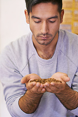 Image showing Man, coffee grain and production with smell, thinking and organic beans for export at warehouse. Person, employee and crop for manufacturing, industry and factory for quality assurance in Colombia