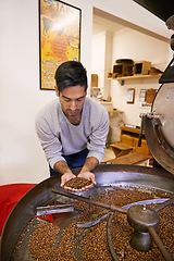 Image showing Coffee, quality and man with machine for roast with blend, production and small business. Entrepreneur, barista or worker checking beans at cafe, sustainable startup or espresso process in Colombia