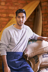 Image showing Man, storage and portrait with bag for coffee beans, quality assurance or pride with product for export. Barista, person and caffeine trading with organic process, manufacturing or factory for stock