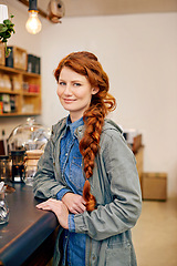 Image showing Happy woman, coffee shop and portrait by counter for checkout, drink and customer to buy a espresso. Young, redhead and smile for relax in cafe, relax and thirsty consumer for warm beverage on break