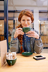 Image showing Woman, cup and smile in coffee shop for portrait at breakfast to start morning at table. Girl, person and happy in cafeteria with flavor, aroma and relax in restaurant for catering service in Dublin