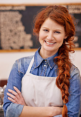 Image showing Barista, woman and arms crossed in portrait at coffee shop with smile, pride and entrepreneurship. Person, waitress or small business owner at cafeteria with confidence for service, catering or job