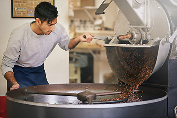 Image showing Coffee shop, small business and man at machine for roasting with blending, production or quality control. Entrepreneur, barista or roaster with beans at cafe, sustainable startup and espresso process