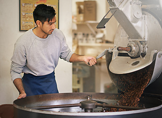 Image showing Coffee beans, small business and man with machine for roasting with blending, production and quality control. Entrepreneur, barista or roaster at cafe, sustainable startup shop and espresso process